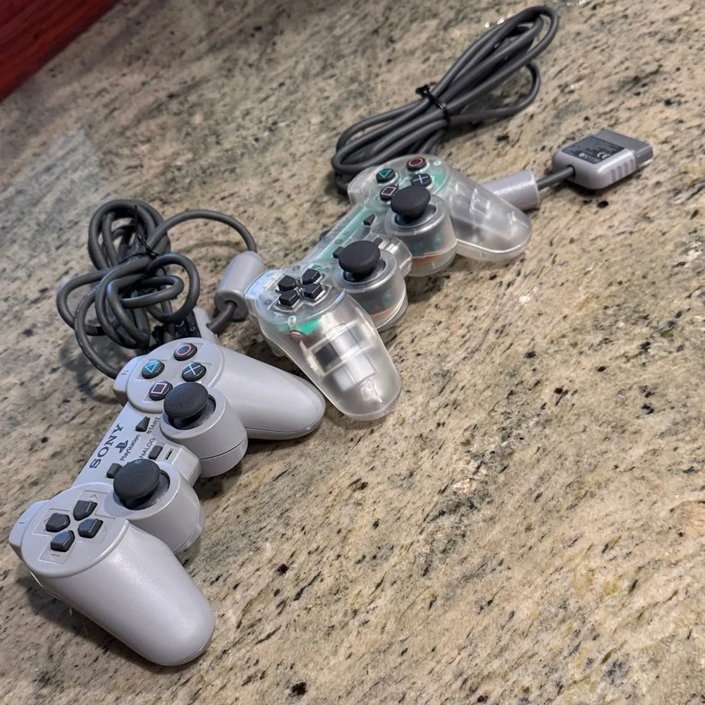 Set of 2 Sony DualShock Controllers in Gray and Transparent